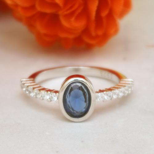 92.5 STERLING SILVER BLUE STONE AND CZ RING