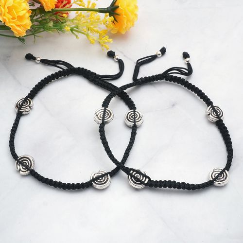 THREAD ANKLET WITH FLORAL SILVER CHARMS