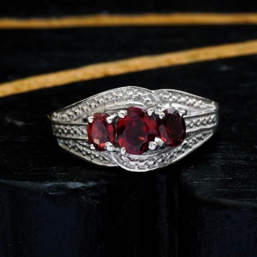 STERLING SILVER  GARNET AND CZ RING